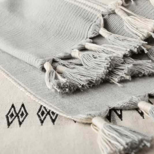 Nagaland Sekrenyi handcrafted cotton throw blanket; artisan-made with traditional weave patterns and soft cotton texture, perfect for adding warmth and cultural charm to sofas, chairs, or beds.