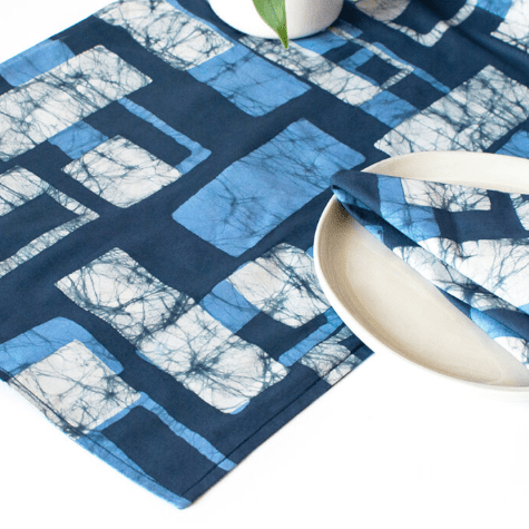 Short organic cotton table runner; reversible and topstitched for durability and style, perfect for dining tables, sideboards, or as an accent piece in home décor. Blocks
