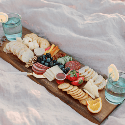 24-inch acacia wood serving board, handcrafted for serving and display.