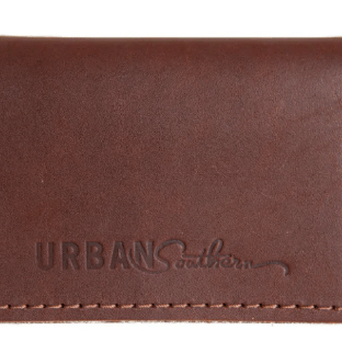 Full-grain leather bifold card wallet with multiple card slots, durable stitching, compact design for everyday organization, and effortless style. Chestnut Brown