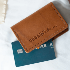 Full-grain leather bifold card wallet with multiple card slots, durable stitching, compact design for everyday organization, and effortless style. Honey