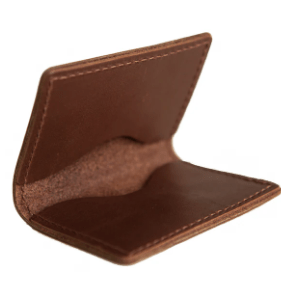 Full-grain leather bifold card wallet with multiple card slots, durable stitching, compact design for everyday organization, and effortless style. Rustic Brown