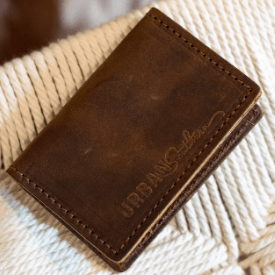 Full-grain leather bifold card wallet with multiple card slots, durable stitching, compact design for everyday organization, and effortless style. Rustic Brown