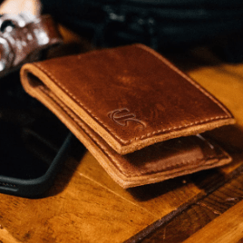 Full-grain leather bifold wallet with multiple card slots, spacious full-length bill compartment, expertly stitched for durability, classic timeless design for everyday use.