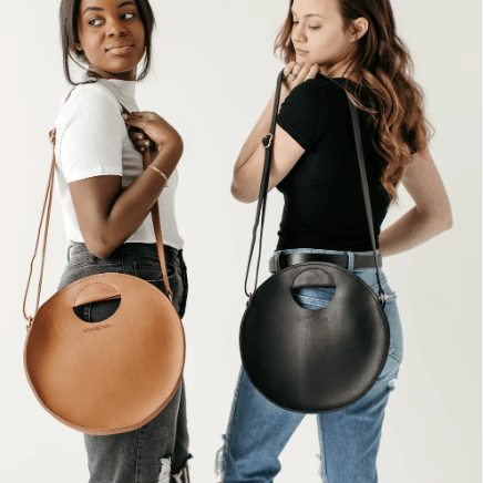 Britt Full-Grain Leather Circle Crossbody Bag, handcrafted design with adjustable strap, ideal for hands-free everyday style and versatile outfits. Honey and Black