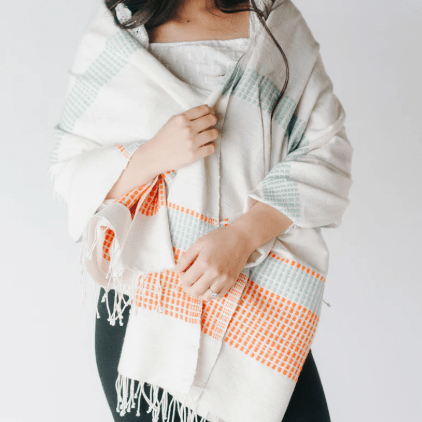 Camden throw: soft, versatile textile perfect for layering on sofas, chairs, or beds, adding warmth, texture, and a stylish accent to home décor. Azure & Tangerine