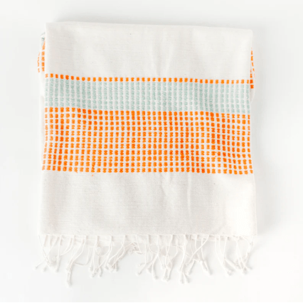Camden throw: soft, versatile textile perfect for layering on sofas, chairs, or beds, adding warmth, texture, and a stylish accent to home décor. Azure & Tangerine