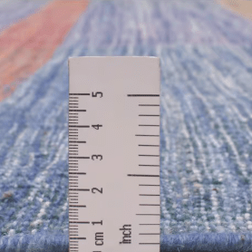 Jalal Kelim Arcobaleno handwoven area rug, artisan-crafted with a bold geometric design in rich tones, featuring a durable wool-cotton blend suitable for living rooms and statement spaces.