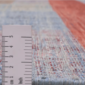 Jalal Kelim Arcobaleno handwoven wool flatweave rug, crafted with vibrant geometric patterns and a durable low-profile design, ideal for layering or modern interiors.