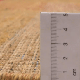 Jalal Kelim Arcobaleno large handwoven wool flatweave rug in warm earth tones, featuring intricate geometric detailing and a durable, artisan-crafted weave for contemporary and rustic interiors. 