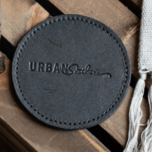 Set of round leather coasters in Black, handcrafted to protect surfaces and add style to your home.