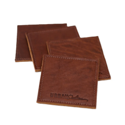 Set of square leather coasters in chestnut brown, handcrafted to protect surfaces and add style to your home.