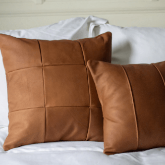 Leather accent pillow with removable top-grain leather cover, soft supportive Polyfill insert, modern striped design, perfect for sofas, beds, and stylish home décor. 
