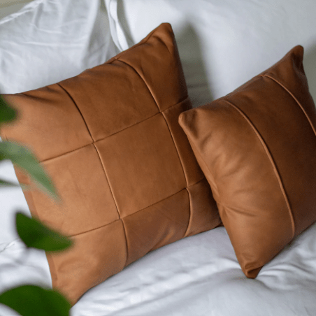 Leather accent pillow with removable top-grain leather cover, soft supportive Polyfill insert, modern striped design, perfect for sofas, beds, and stylish home décor. 