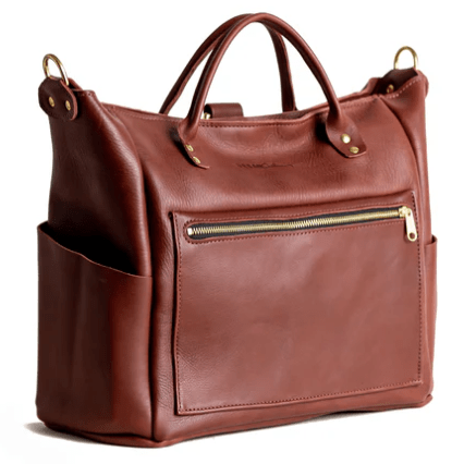 Legacy Backpack Tote is a versatile and stylish bag designed for everyday use, featuring comfortable straps and durable construction.  Chestnut Brown