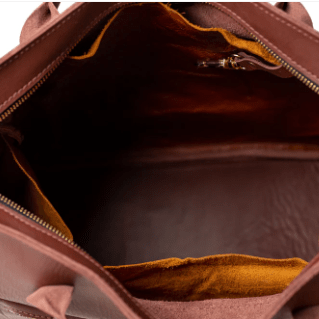 Legacy Backpack Tote is a versatile and stylish bag designed for everyday use, featuring comfortable straps and durable construction.  Chestnut Brown