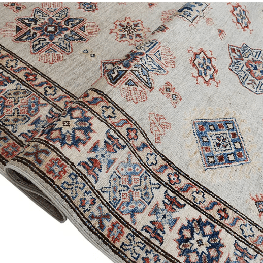 Loomier Ghazni handmade wool area rug in earth tones with blue accents, hand-knotted for durability and style, ideal for living rooms, bedrooms, or cozy corners.