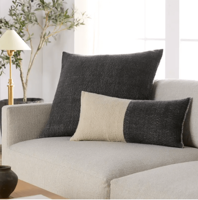 Margosa Abdul 100% wool lumbar pillow, handcrafted in a duo-tone design; 13x25-inch rectangular accent pillow for sofas, chairs, or beds, adding artisan-crafted texture and style. Polyester Ebony