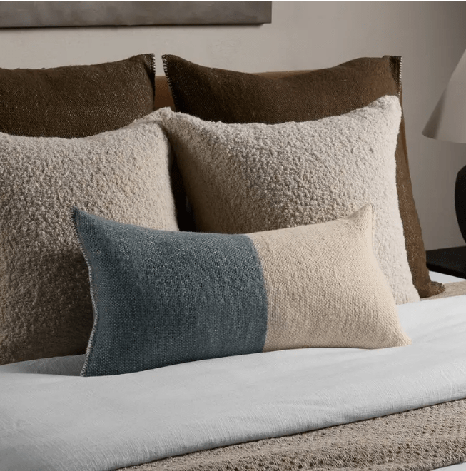 Margosa Abdul 100% wool lumbar pillow, handcrafted in a duo-tone design; 13x25-inch rectangular accent pillow for sofas, chairs, or beds, adding artisan-crafted texture and style. Polyester Wood Ash