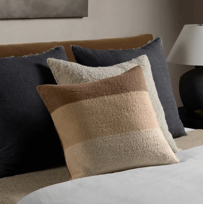 Margosa ‘Laco’ 100% wool pillow featuring multi-brown stripes and decorative button accents, ideal for living rooms, bedrooms, or cozy lounge spaces. Cover Only