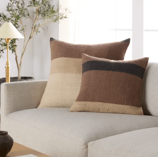 Margosa ‘Laco’ 100% wool pillow featuring multi-brown stripes and decorative button accents, ideal for living rooms, bedrooms, or cozy lounge spaces. Down Alternative