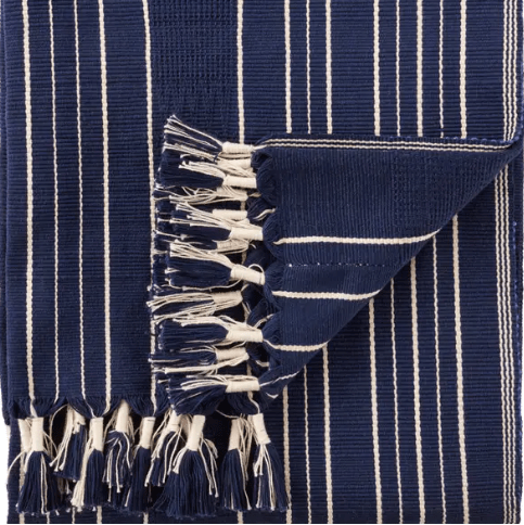 Nagaland Kiphire handcrafted cotton throw blanket featuring the Imena tribal design in royal blue and ivory; artisan-woven textile adding cultural artistry and soft comfort to sofas, chairs, or beds.
