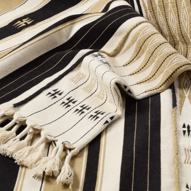 Nagaland Phom handcrafted cotton throw blanket; artisan-woven with traditional detailing and soft cotton texture, ideal for layering over sofas, chairs, or beds for a cozy accent.