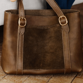 Regina Tote is a stylish and functional handbag for everyday use, featuring durable construction and a roomy interior for essentials. Mocha