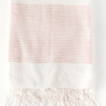 Riviera cotton throw blanket: soft and breathable textile perfect for layering on sofas, chairs, or beds, adding comfort and casual elegance to home décor.