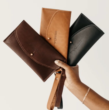 Ruby leather wristlet wallet with secure zip closure, compact design for essentials, versatile accessory for everyday use.