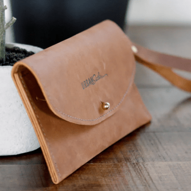 Ruby leather wristlet wallet with secure zip closure, compact design for essentials, versatile accessory for everyday use. Honey