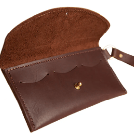 Ruby leather wristlet wallet with secure zip closure, compact design for essentials, versatile accessory for everyday use. Rustic Brown