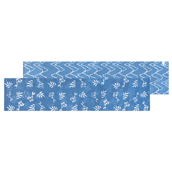 Short organic cotton table runner; reversible and topstitched for durability and style, perfect for dining tables, sideboards, or as an accent piece in home décor. Light blue leaves