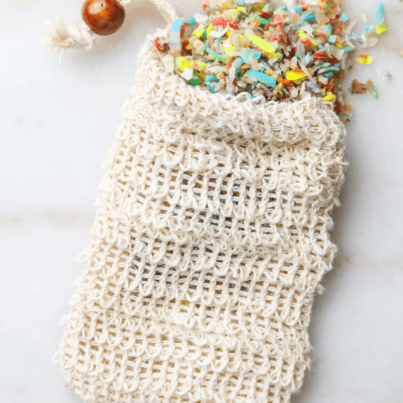Soapfetti™ with sisal soap saver bag; artisanal soap flakes packaged with a reusable sisal bag for exfoliating and cleansing, perfect for gentle, eco-friendly skin care.