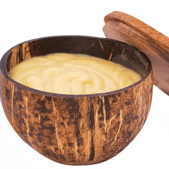 Unscented shea butter with lavender oil in a reusable coconut shell container.