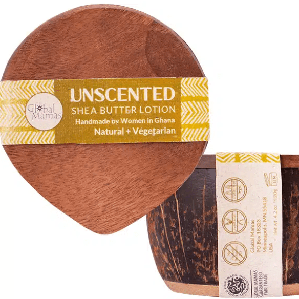 Unscented shea butter in a repurposed coconut shell container, handmade in Ghana.