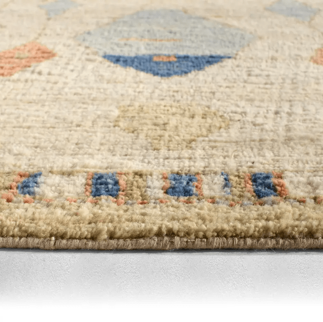 Zaira Tonnara hand-knotted 100% wool rug featuring a modern Moroccan geometric diamond pattern; artisan-crafted area rug offering luxurious texture and timeless design for living spaces. Side